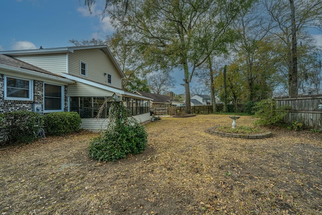 view of yard with a sunroom