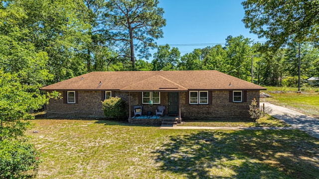 565 Estates Dr, Walterboro, SC 29488 - single story home featuring a front lawn, covered porch, brick siding, and roof with shingles