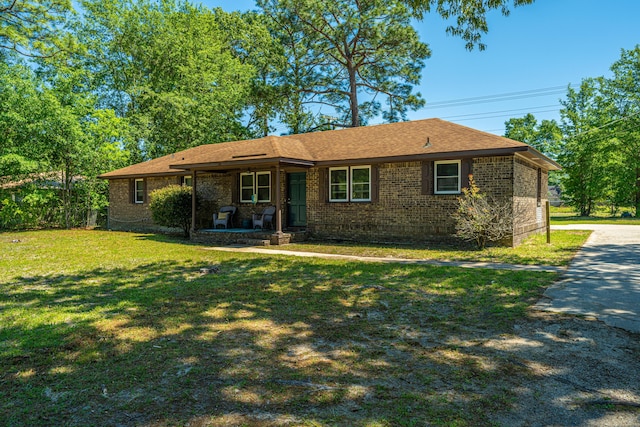 565 Estates Dr, Walterboro, SC 29488 - single story home featuring brick siding, a front lawn, covered porch, and roof with shingles