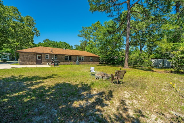 565 Estates Dr, Walterboro, SC 29488 - view of yard featuring an outdoor fire pit and a patio