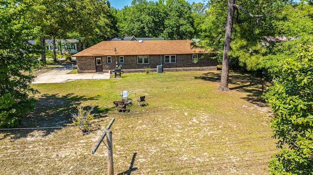 565 Estates Dr, Walterboro, SC 29488 - back of house featuring a yard, brick siding, and a patio