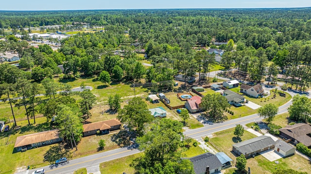 565 Estates Dr, Walterboro, SC 29488 - aerial view of property and surrounding area with a heavily wooded area and nearby suburban area