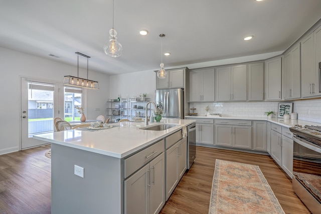 175 Darby Meadow Ln, Ridgeville, SC 29472 - kitchen with gray cabinetry, a sink, appliances with stainless steel finishes, light countertops, and recessed lighting