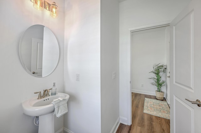 175 Darby Meadow Ln, Ridgeville, SC 29472 - bathroom featuring wood finished floors, baseboards, and a sink