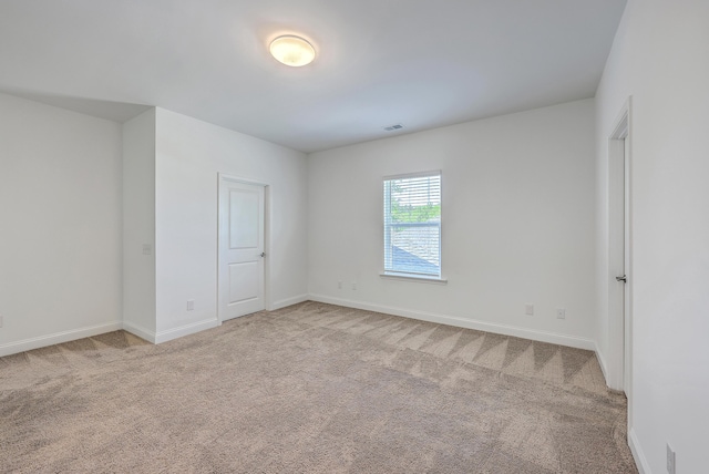 175 Darby Meadow Ln, Ridgeville, SC 29472 - spare room featuring light colored carpet and baseboards