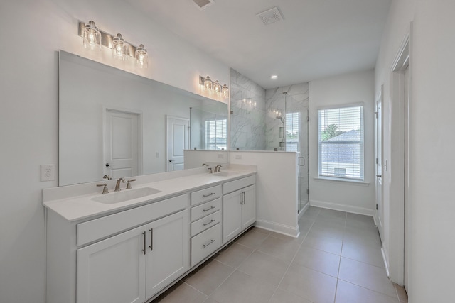 175 Darby Meadow Ln, Ridgeville, SC 29472 - bathroom featuring a stall shower, double vanity, tile patterned floors, and baseboards