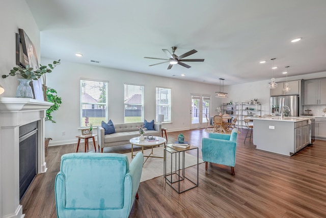 175 Darby Meadow Ln, Ridgeville, SC 29472 - living room with a ceiling fan, a glass covered fireplace, dark wood finished floors, recessed lighting, and baseboards