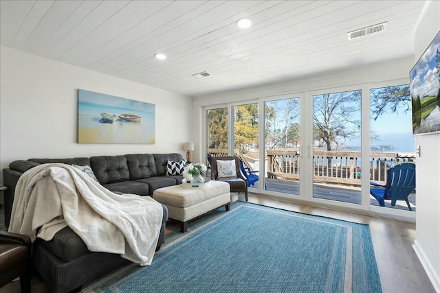 living room with hardwood / wood-style floors and wood ceiling