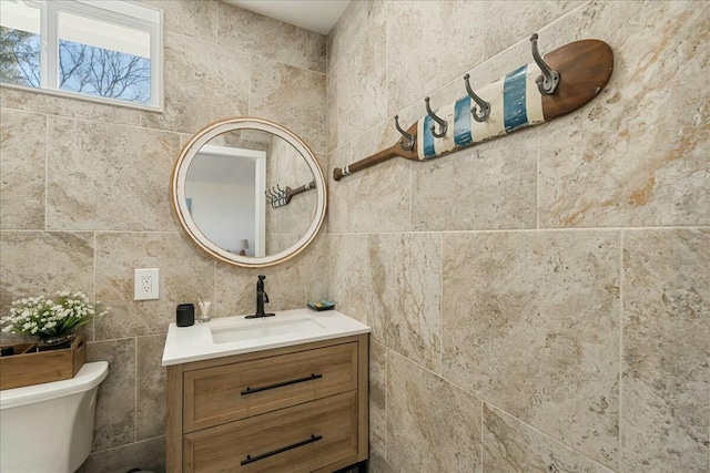 bathroom with vanity and toilet