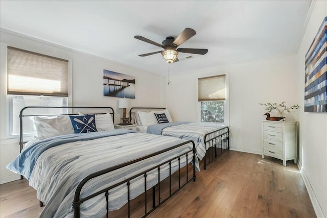 bedroom featuring hardwood / wood-style floors and ceiling fan