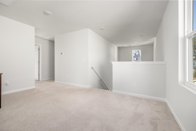 empty room featuring light colored carpet