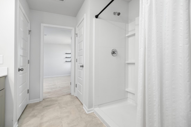 bathroom featuring walk in shower