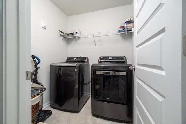 laundry area with separate washer and dryer