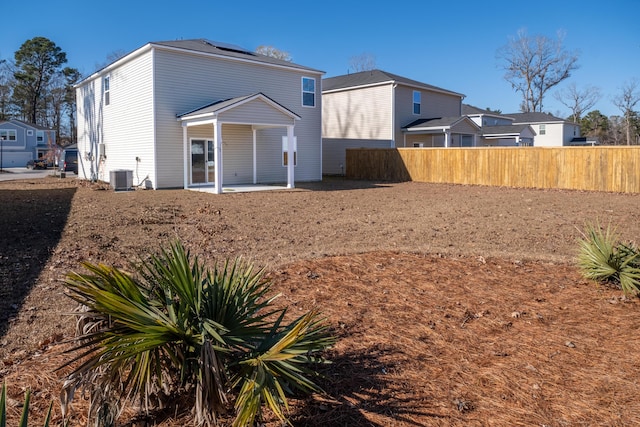 back of property featuring central AC and a patio