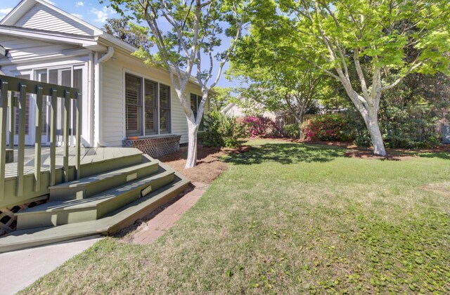 view of yard with a wooden deck