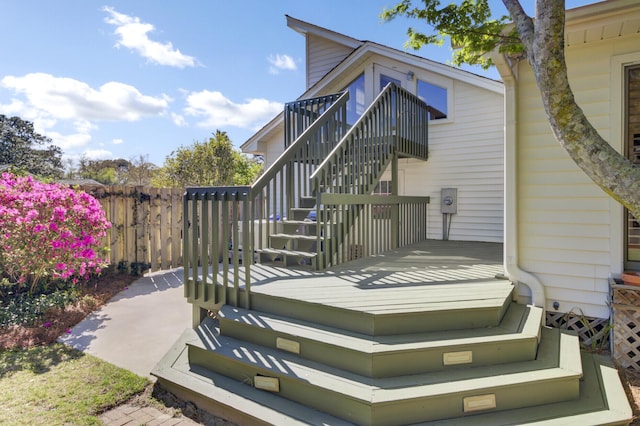 exterior space featuring fence and stairs