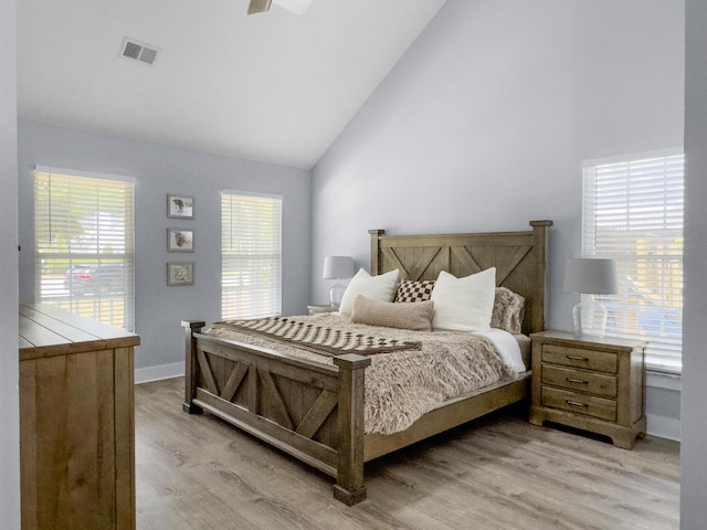 1410 Diamond Blvd, Mount Pleasant, SC 29466 - bedroom with light wood-type flooring, high vaulted ceiling, and access to exterior