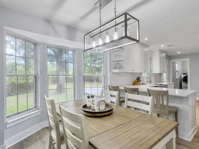 1410 Diamond Blvd, Mount Pleasant, SC 29466 - dining space featuring washer / dryer, wood finished floors, and recessed lighting