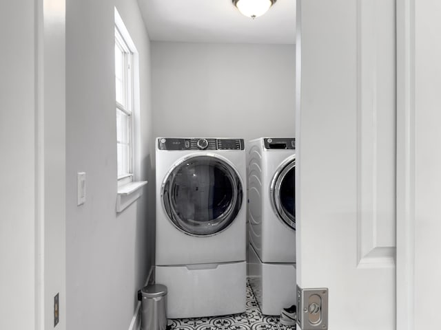 1410 Diamond Blvd, Mount Pleasant, SC 29466 - laundry room with washing machine and clothes dryer and tile patterned flooring