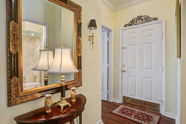 entrance foyer with crown molding and dark hardwood / wood-style floors