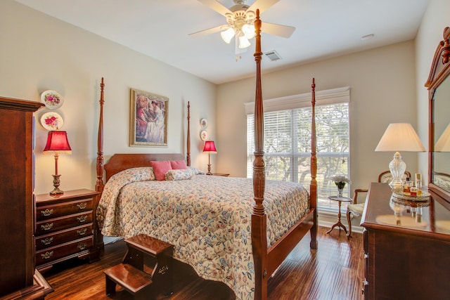 bedroom with dark wood-type flooring and ceiling fan