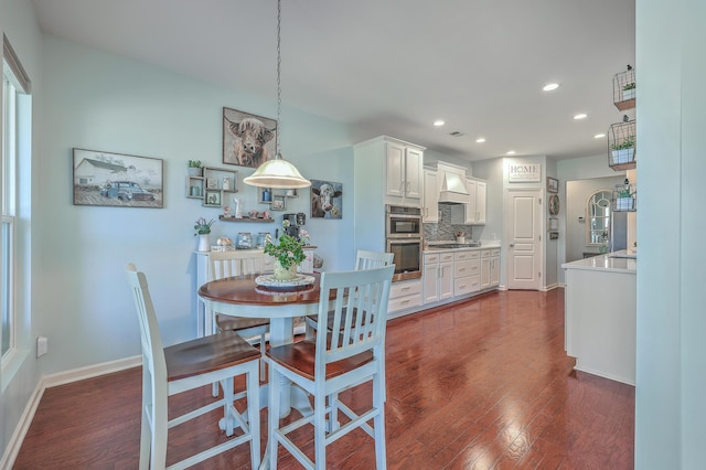 dining area featuring dark hardwood / wood-style flooring