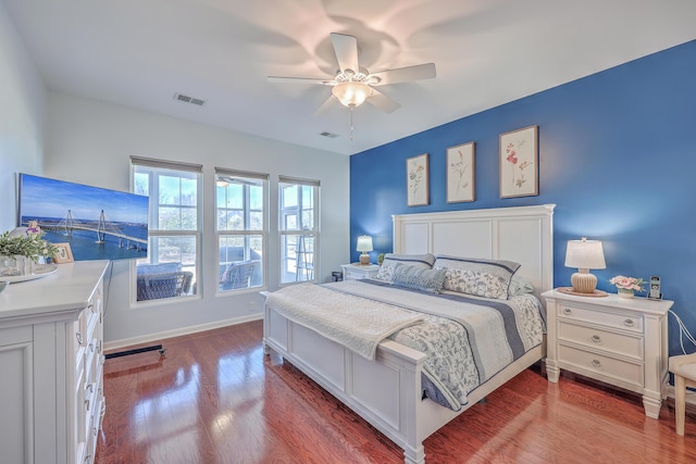 bedroom with ceiling fan and hardwood / wood-style floors