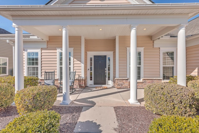 doorway to property with a porch