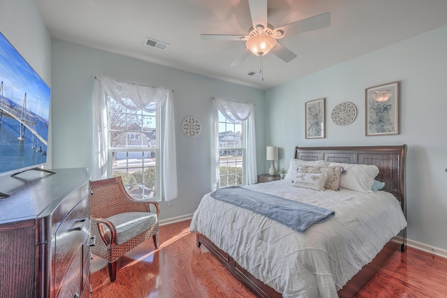 bedroom with ceiling fan and hardwood / wood-style floors