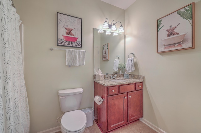 bathroom with vanity, walk in shower, and toilet