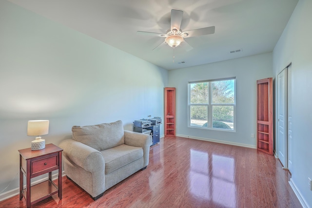 sitting room featuring ceiling fan and wood-type flooring