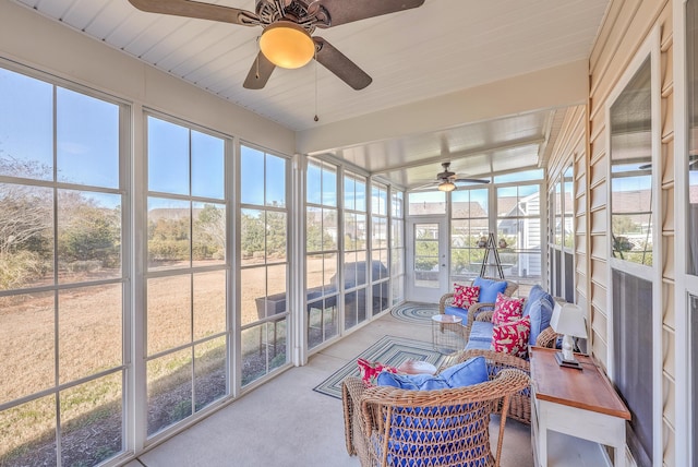 sunroom featuring ceiling fan