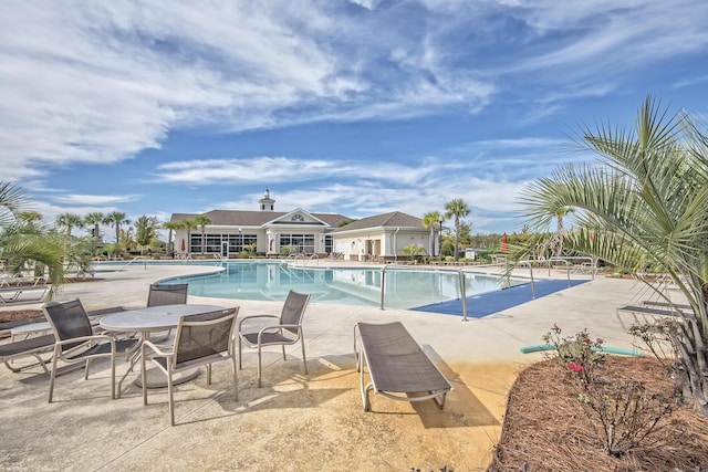 view of swimming pool featuring a patio area