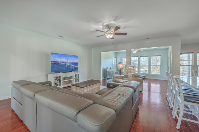 living room with ceiling fan and wood-type flooring