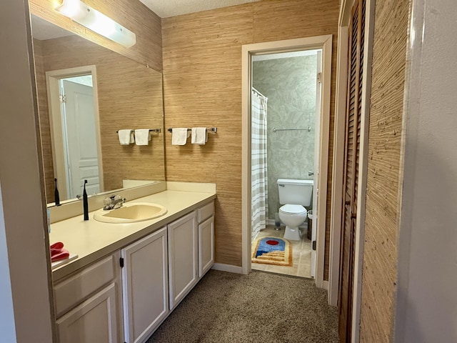 bathroom with vanity, toilet, and a shower with shower curtain