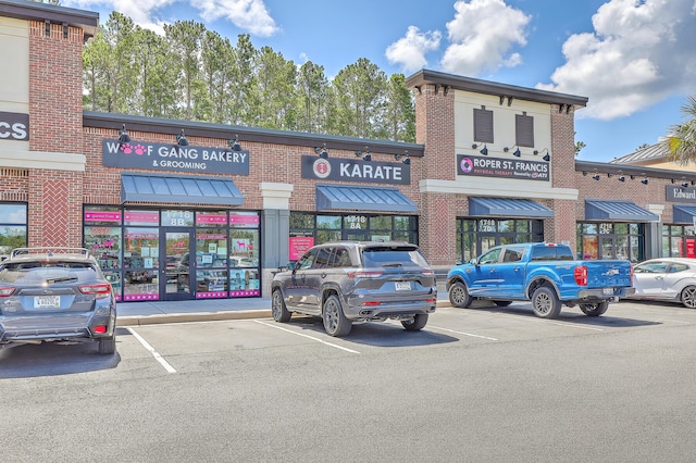 view of property featuring uncovered parking