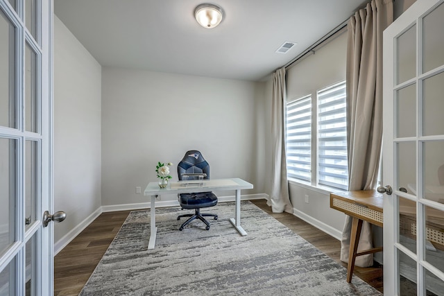 office space featuring french doors, baseboards, dark wood-style floors, and visible vents