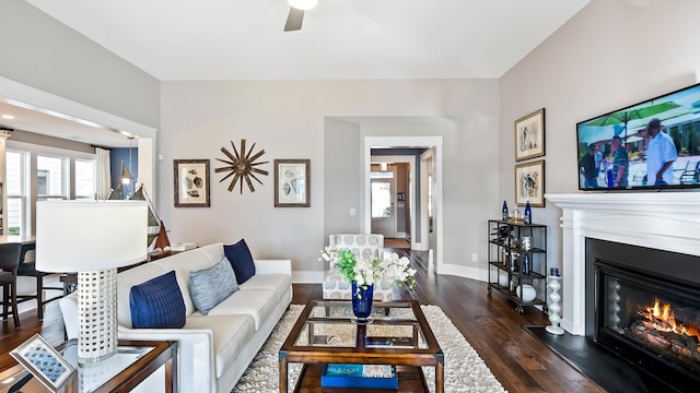 living room featuring dark hardwood / wood-style floors and ceiling fan