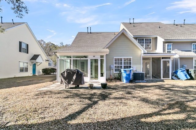 back of house with a yard, central AC, a sunroom, and a patio area