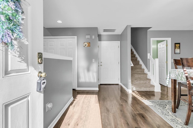 foyer entrance featuring hardwood / wood-style floors