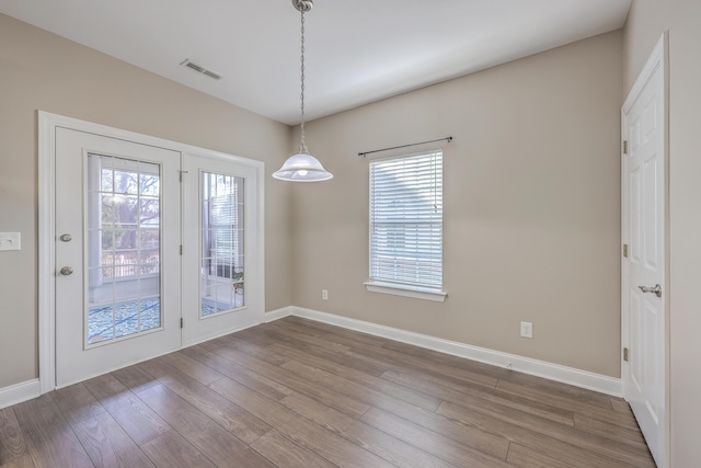 401 Waring St, Summerville, SC 29483 - unfurnished dining area with visible vents, baseboards, and dark wood-style floors