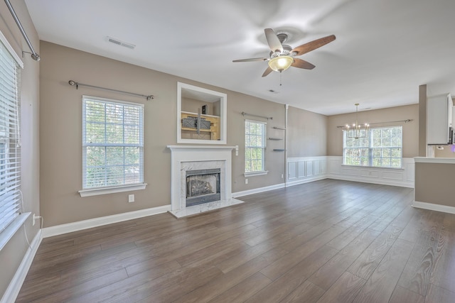 401 Waring St, Summerville, SC 29483 - unfurnished living room featuring a fireplace, dark wood-type flooring, ceiling fan with notable chandelier, and visible vents