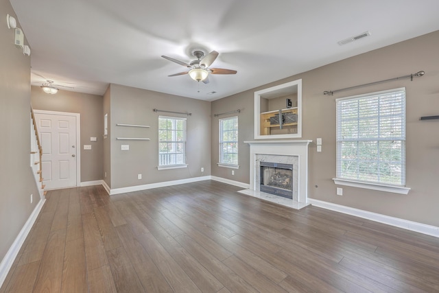 401 Waring St, Summerville, SC 29483 - unfurnished living room featuring visible vents, wood finished floors, a high end fireplace, baseboards, and ceiling fan