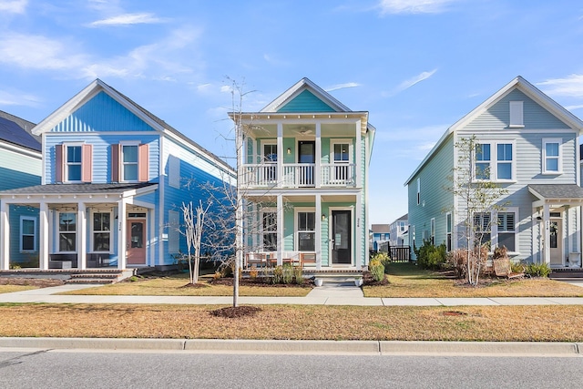 view of front of home featuring a balcony and covered porch