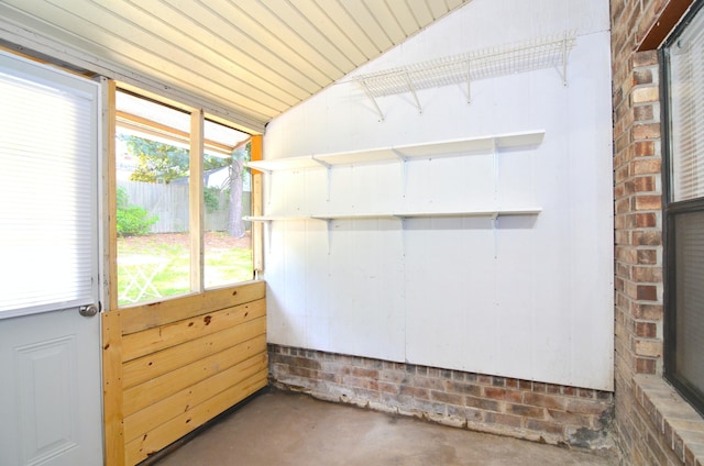 unfurnished sunroom with vaulted ceiling