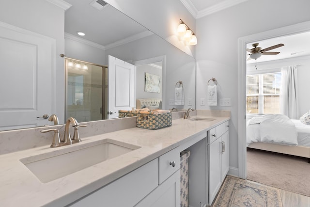 bathroom with ceiling fan, ornamental molding, and vanity