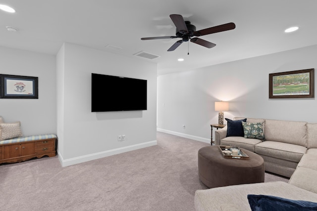 living room with ceiling fan and light colored carpet