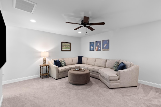 carpeted living room featuring ceiling fan