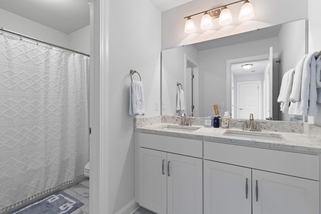 bathroom with toilet and vanity