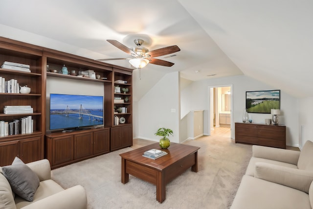 carpeted living room with lofted ceiling and ceiling fan